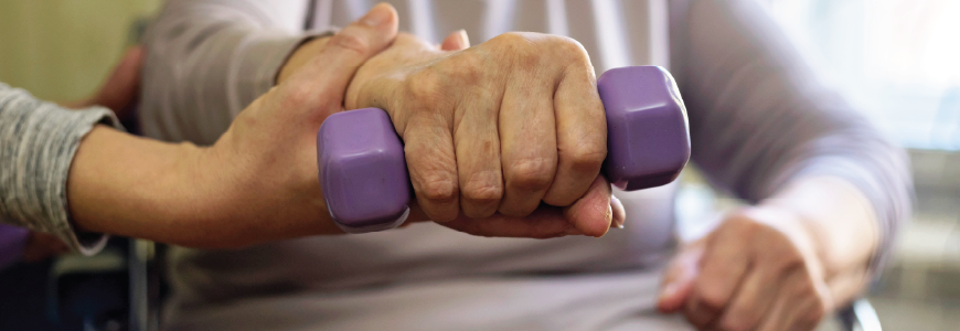 SNF therapist working with resident