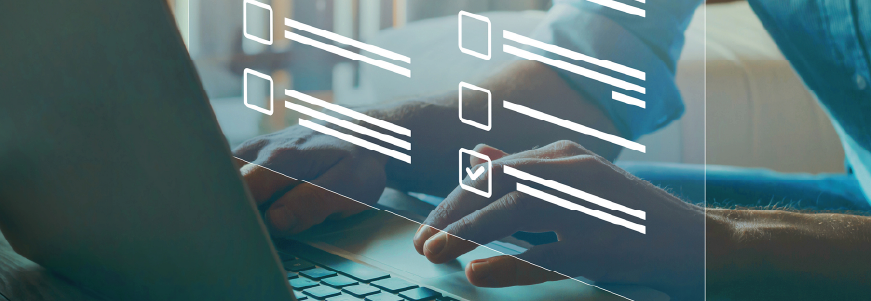 NAC sitting at computer taking AAPACN's Nurse Assessment Coordinator exam